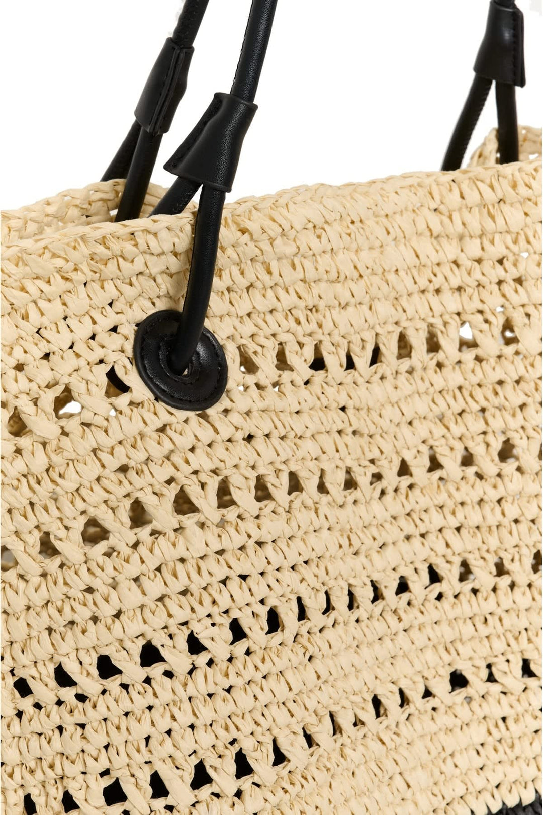 Side view of a natural straw handbag with a braided handle Inwear for women - Valérie Simon