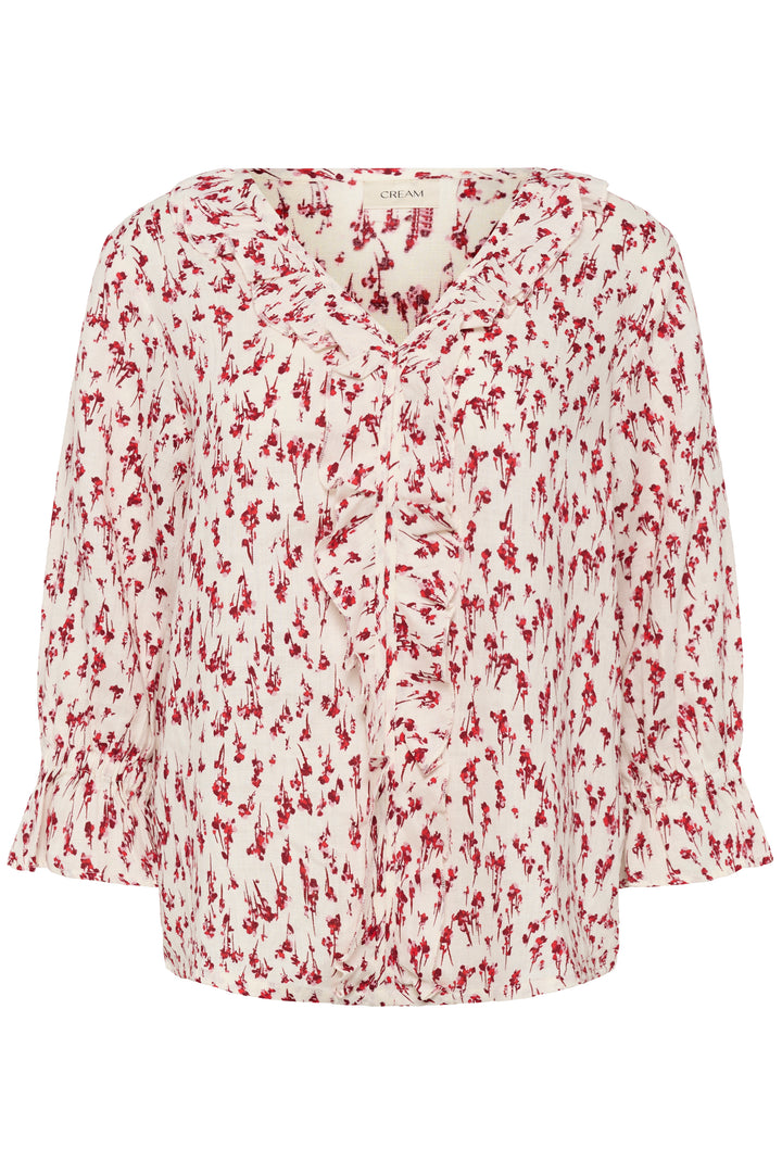 Blouse Bellis avec motif délicat et encolure en V à volants, manches trois-quarts, parfaite pour ajouter élégance et confort.