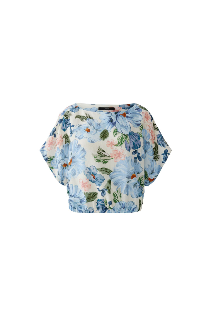 Blouse fluide à manches courtes avec motif floral, idéale pour une allure élégante et confortable au quotidien, coupe ample et encolure arrondie.