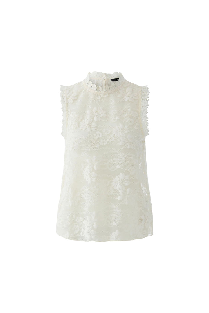 Camisole en dentelle florale avec col montant festonné et épaules structurées, raffinée et élégante pour un style sophistiqué.
