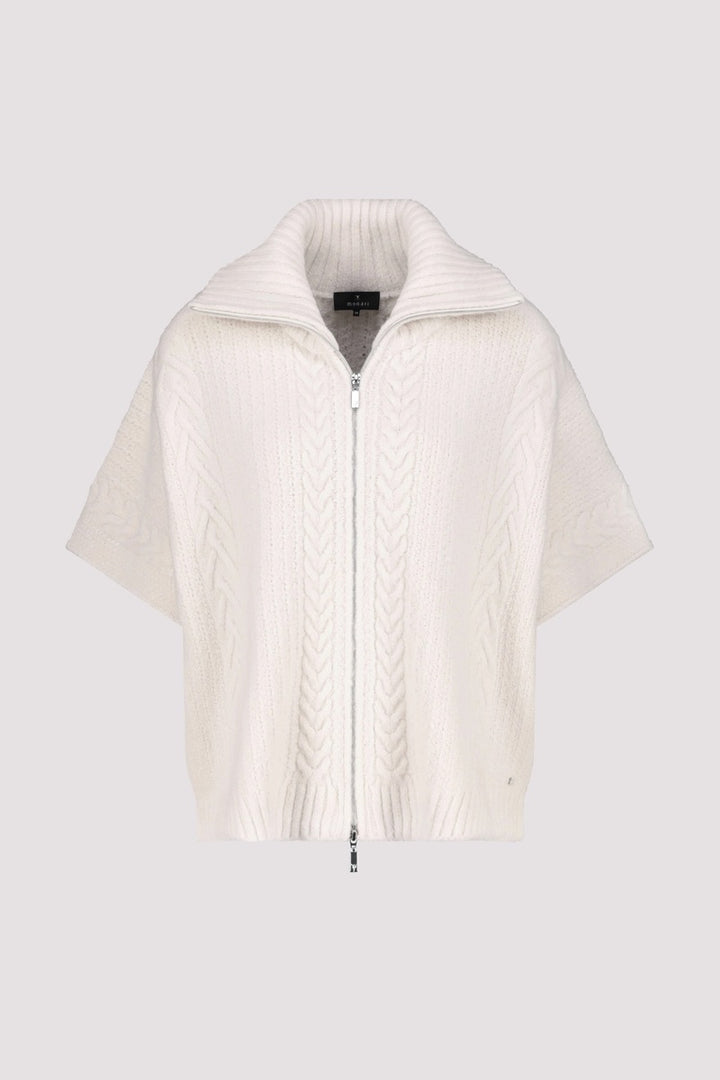 Cardigan oversize en maille torsadée blanche avec col roulé et fermeture éclair à l'avant.