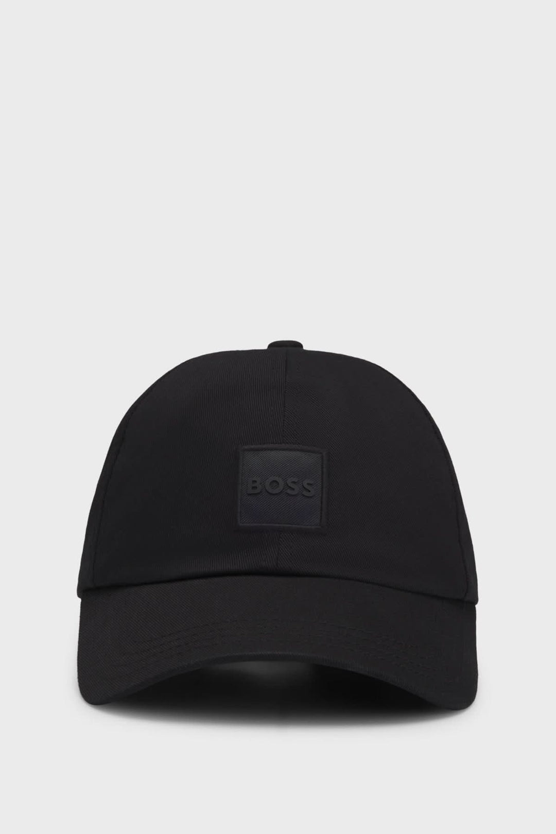 Casquette BOSS noire avec écusson axé sur le style contemporain et décontracté, parfaite pour les tenues estivales.