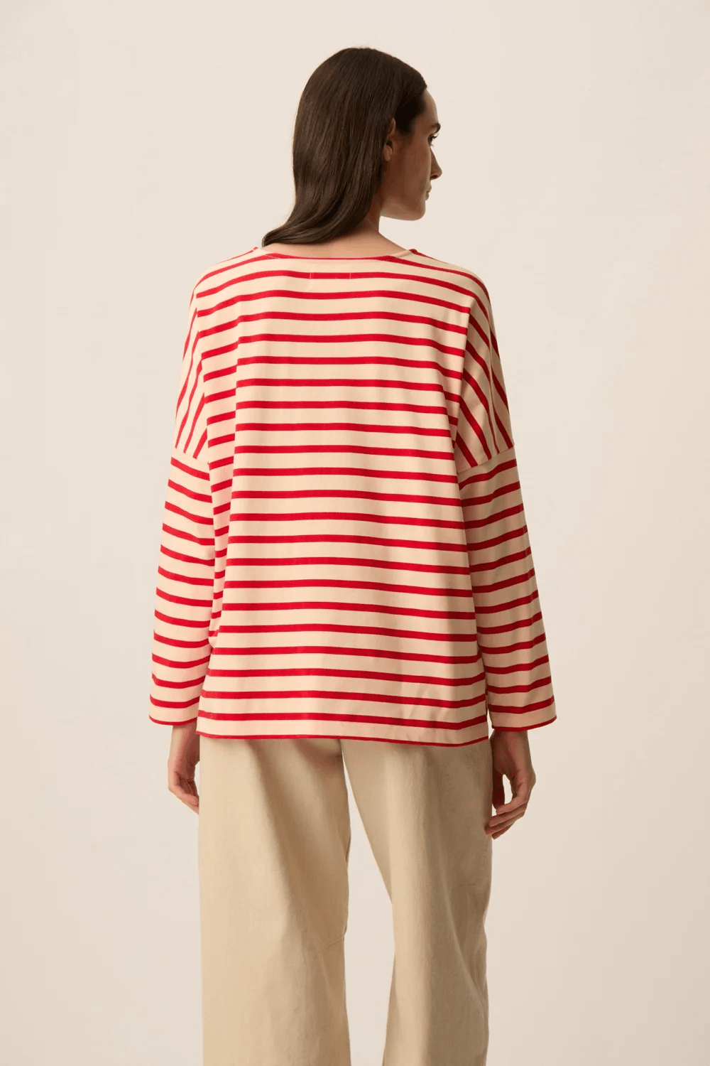 Chandail Filly à manches longues rayé coupe ample, confortable avec manches longues et motif rayé rouge et blanc.
