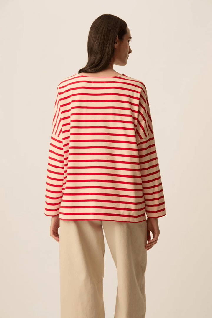 Chandail Filly à manches longues rayé coupe ample, confortable avec manches longues et motif rayé rouge et blanc.