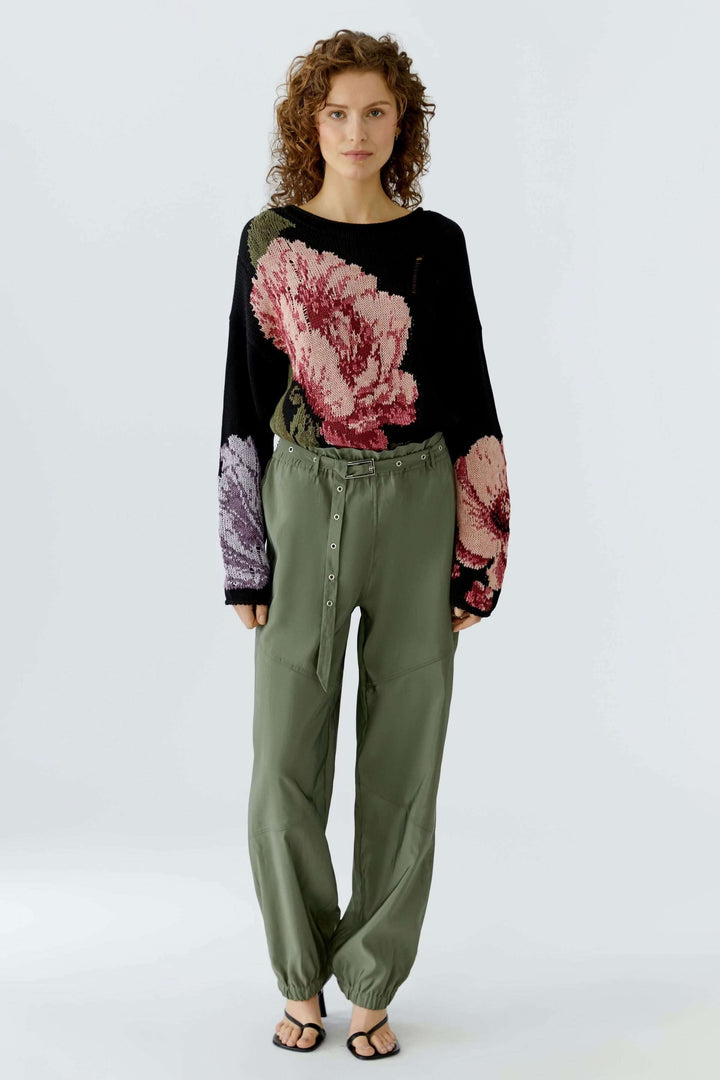 Chandail imprimé floral avec motif expressif, coupe décontractée et encolure arrondie pour un style artistique et confortable.