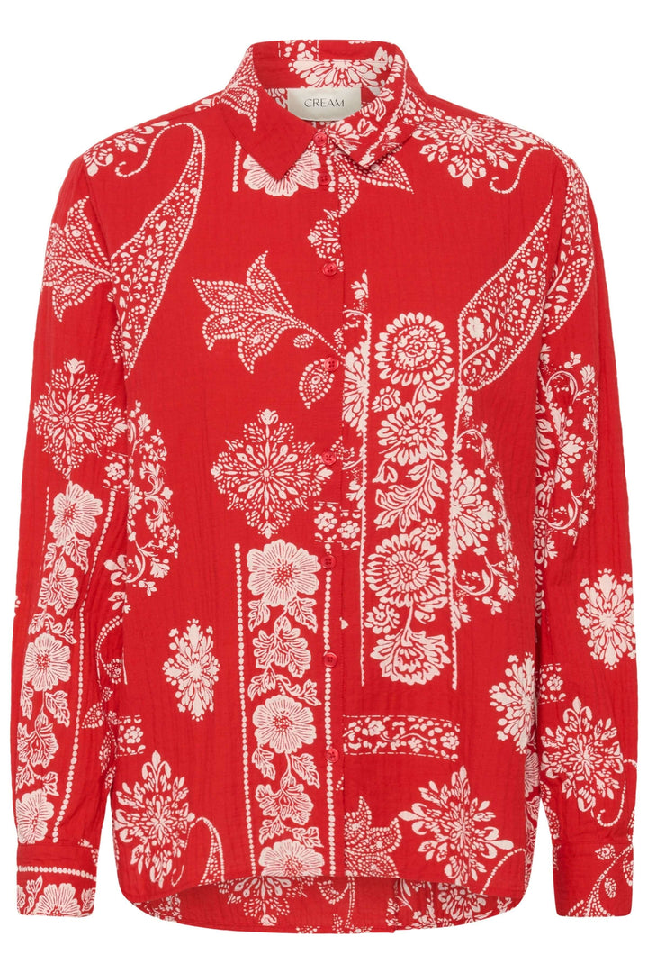 Chemise Gianna imprimée à manches longues avec motif décoratif sur fond rouge.