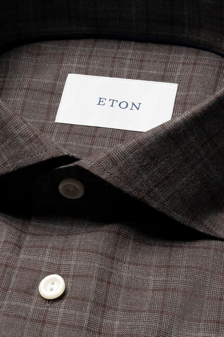 Chemise en flanelle à carreaux marron avec étiquette ETON et bouton, élégante et confortable pour un look raffiné.