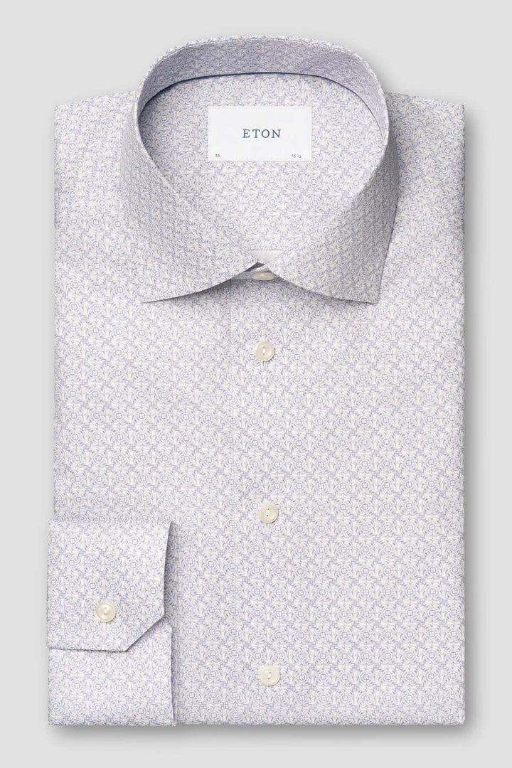 Chemise en sergé à motifs géométriques élégants, parfaite pour un style professionnel raffiné.