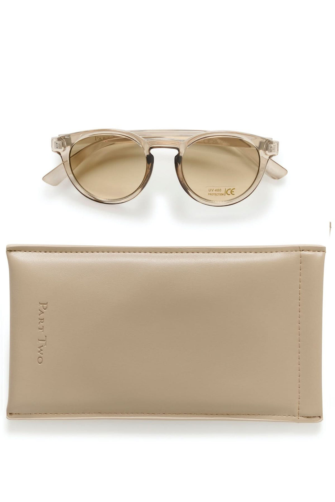 Lunette de soleil Nino avec monture ronde en acétate effet écaille et étui élégant, offrant confort visuel et style décontracté.