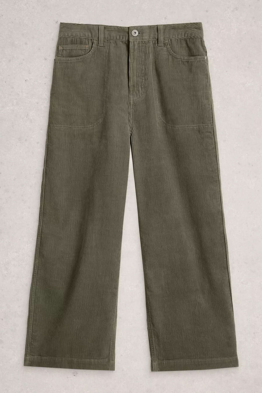 Pantalon Tia en velours côtelé texturé avec coupe évasée et taille haute pour un style moderne et confortable.