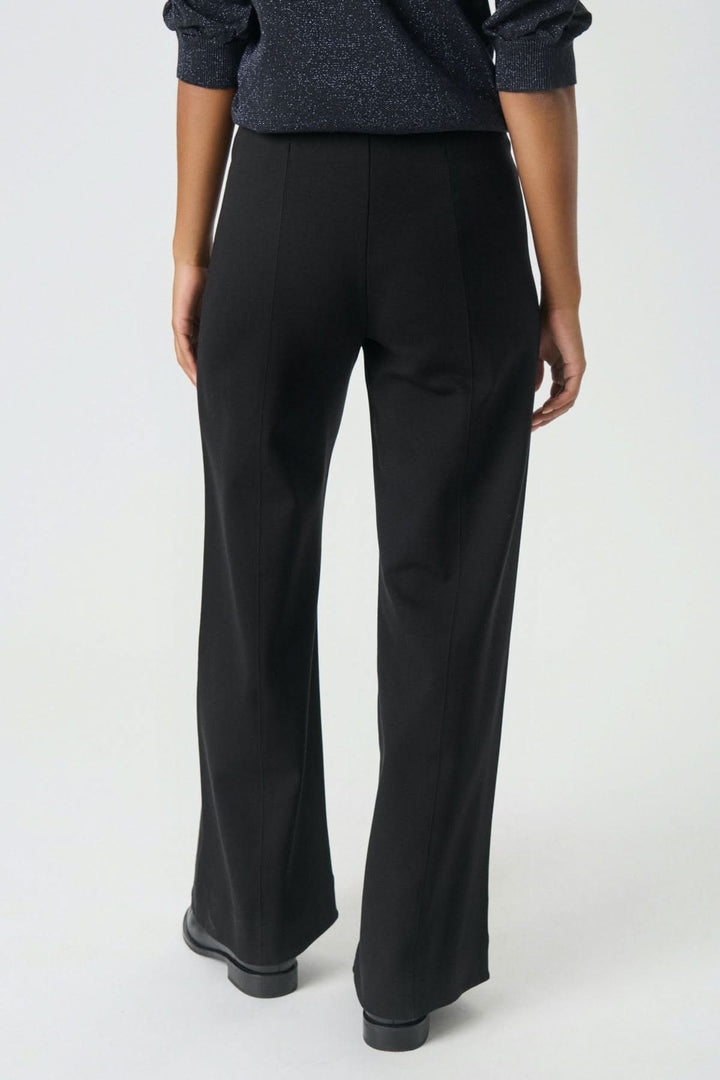 Dos du Pantalon classique Vinda noir large avec taille élastique, confortable et élégant pour bureau et sorties, coupe fluide moderne.