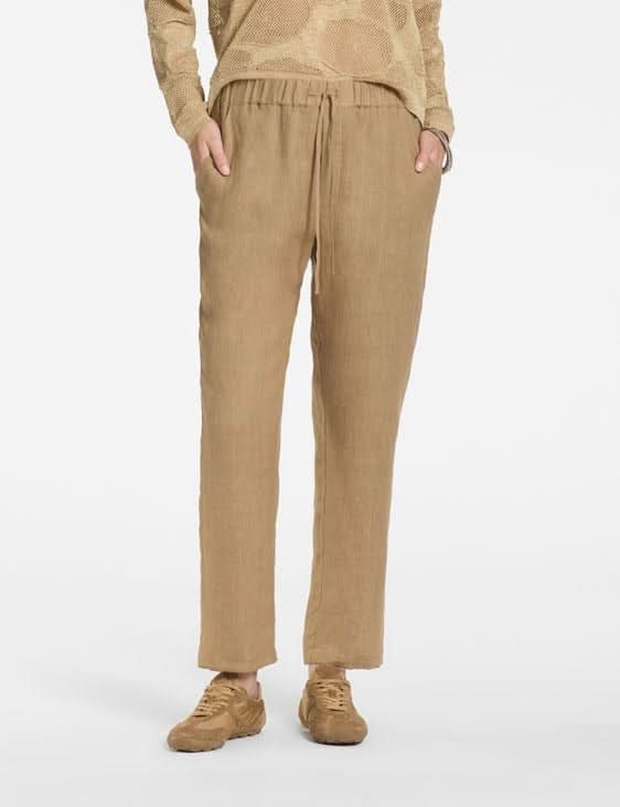 Pantalon en lin à taille élastique pour un style décontracté, matière légère et cordon ajustable, idéal pour une silhouette moderne.