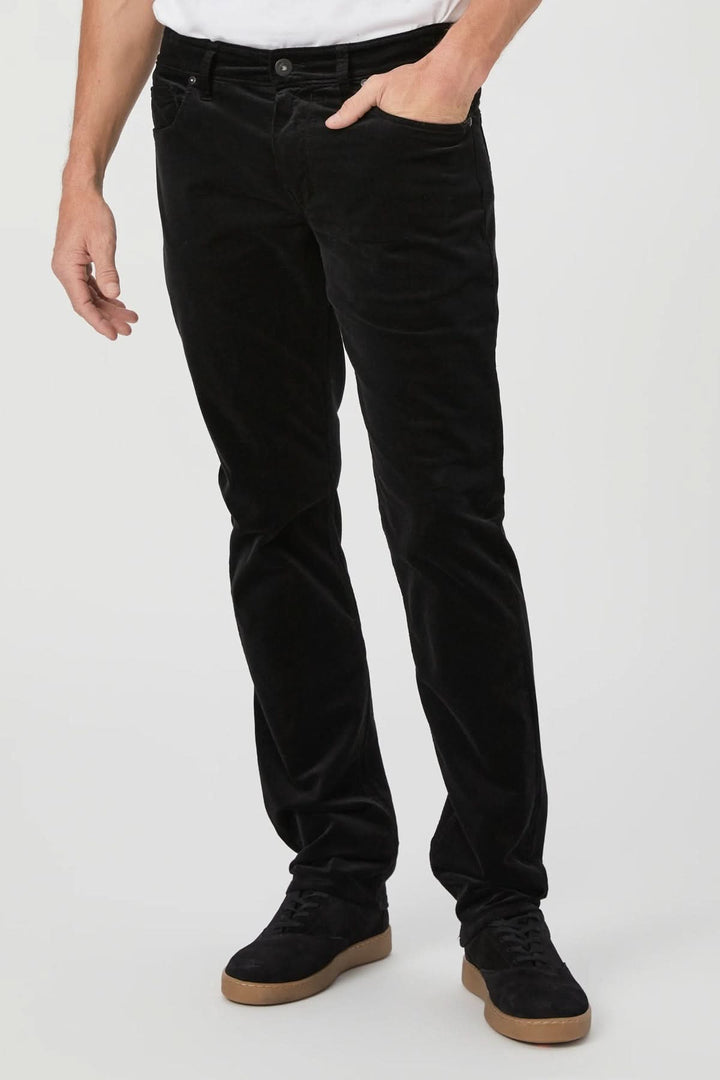 Pantalon en micro corduroy noir, coupe ajustée, confort élégant avec élasticité douce. Décris moi le produit en français.
