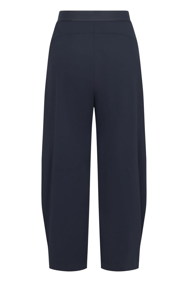 Pantalon fluide à jambe large bleu marine, coupe moderne et épurée, idéal pour un look confortable et sophistiqué.