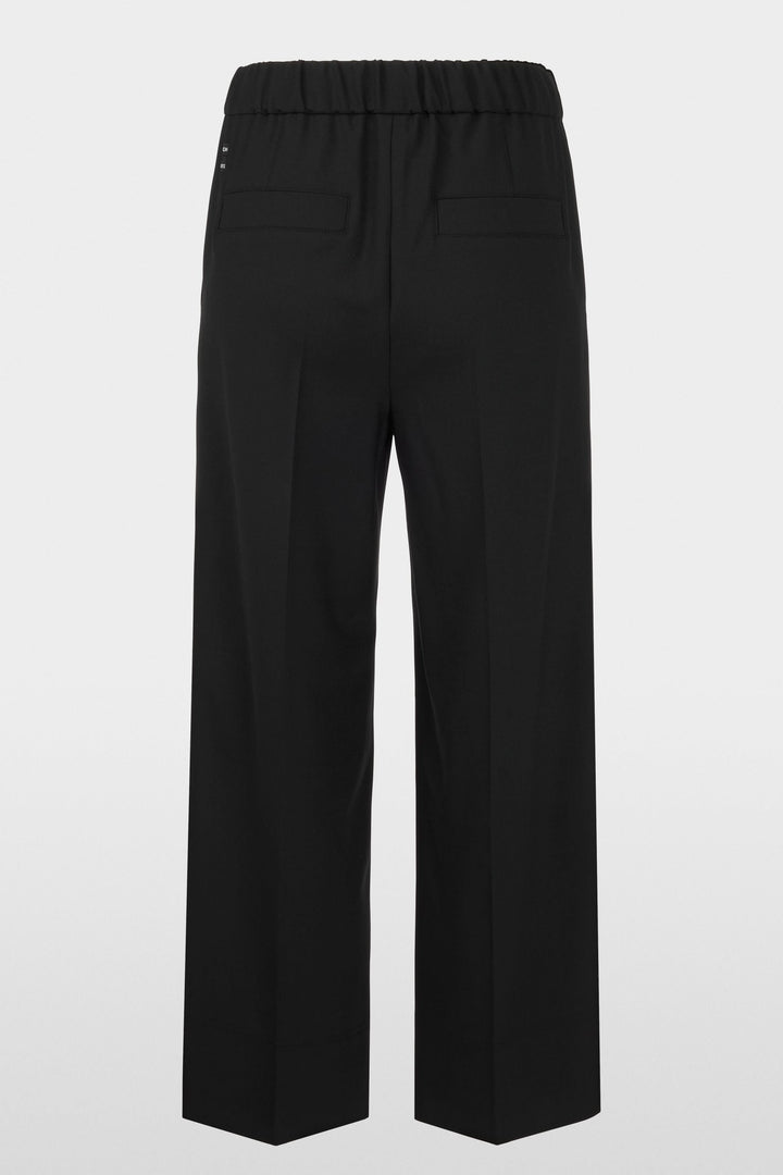 Pantalon large noir avec taille élastique et coupe fluide, idéal pour un look urbain élégant et décontracté.