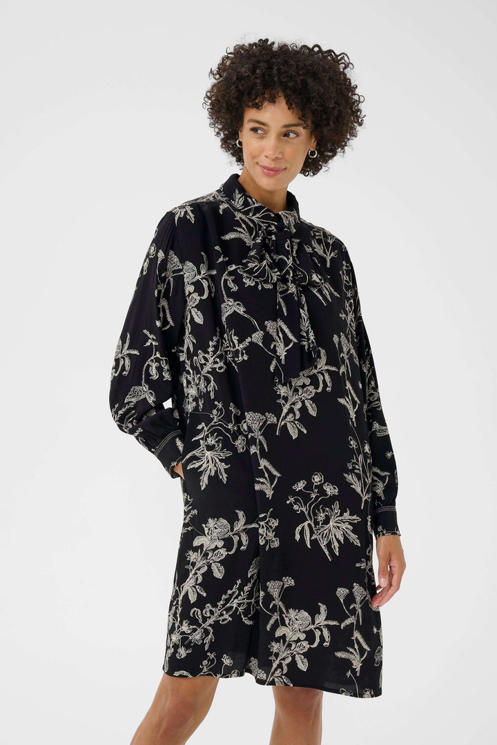 Robe Sanes à imprimé floral avec col lavallière et manches bouffantes, élégante et confortable pour un look chic.