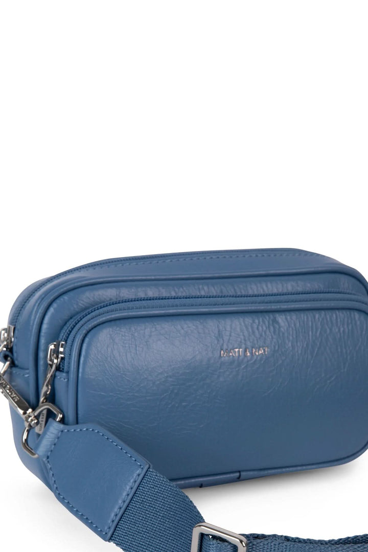 Sac à bandoulière bleu avec bretelle ajustable et poches pratiques, idéal pour téléphone et objets essentiels.