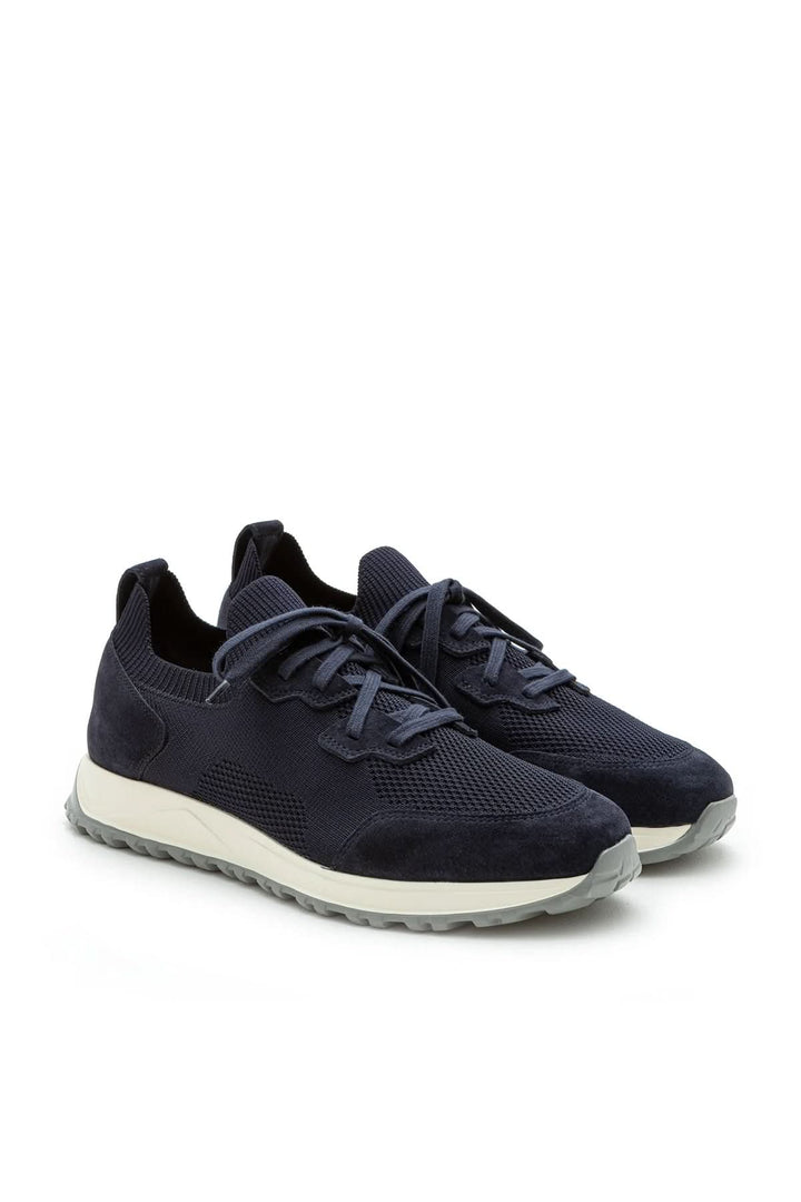 Sneaker homme cuir et tissu extensible en bleu avec semelle légère, design moderne pour un style raffiné et confort exceptionnel.