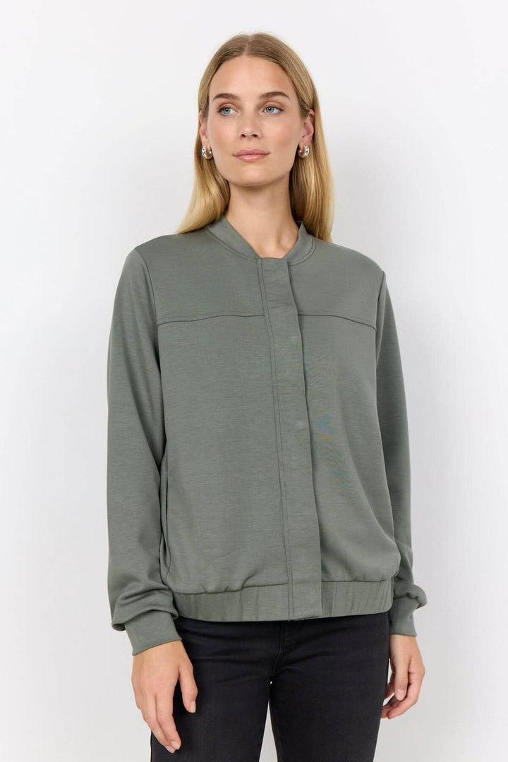 Veste à bouton-pression en modal, manches longues et col mao, idéale pour un look chic et décontracté.