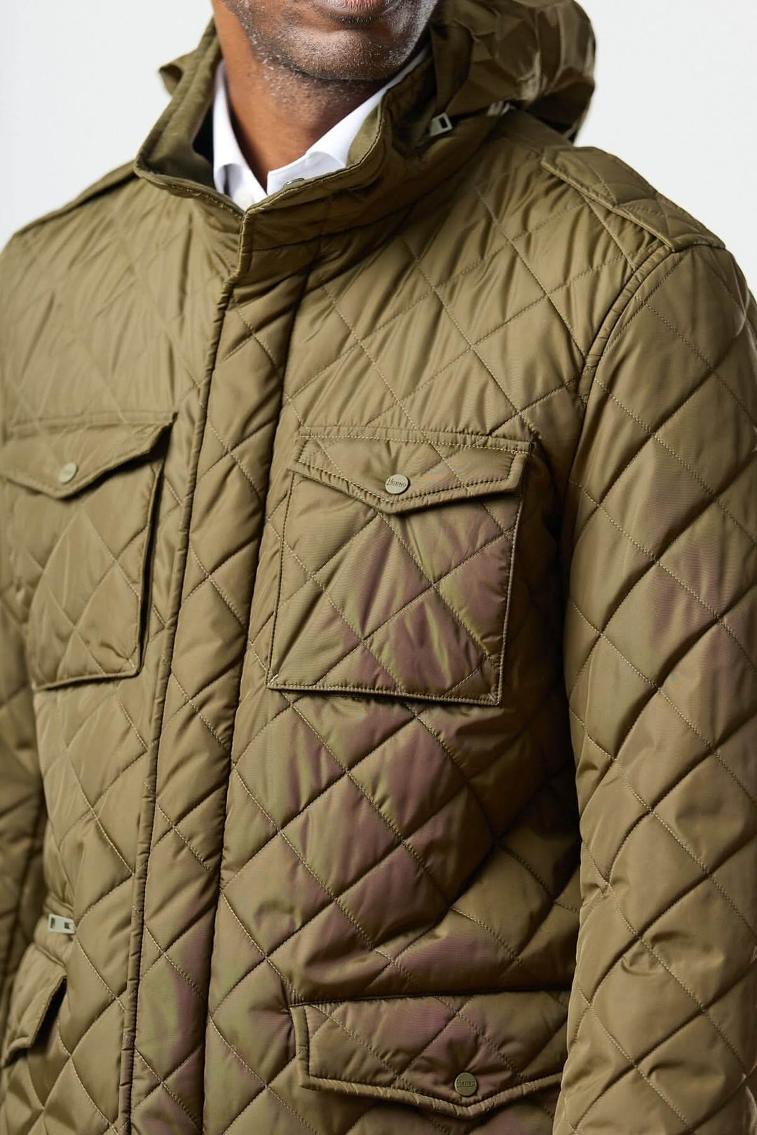 Quilted jacket with stowable hood