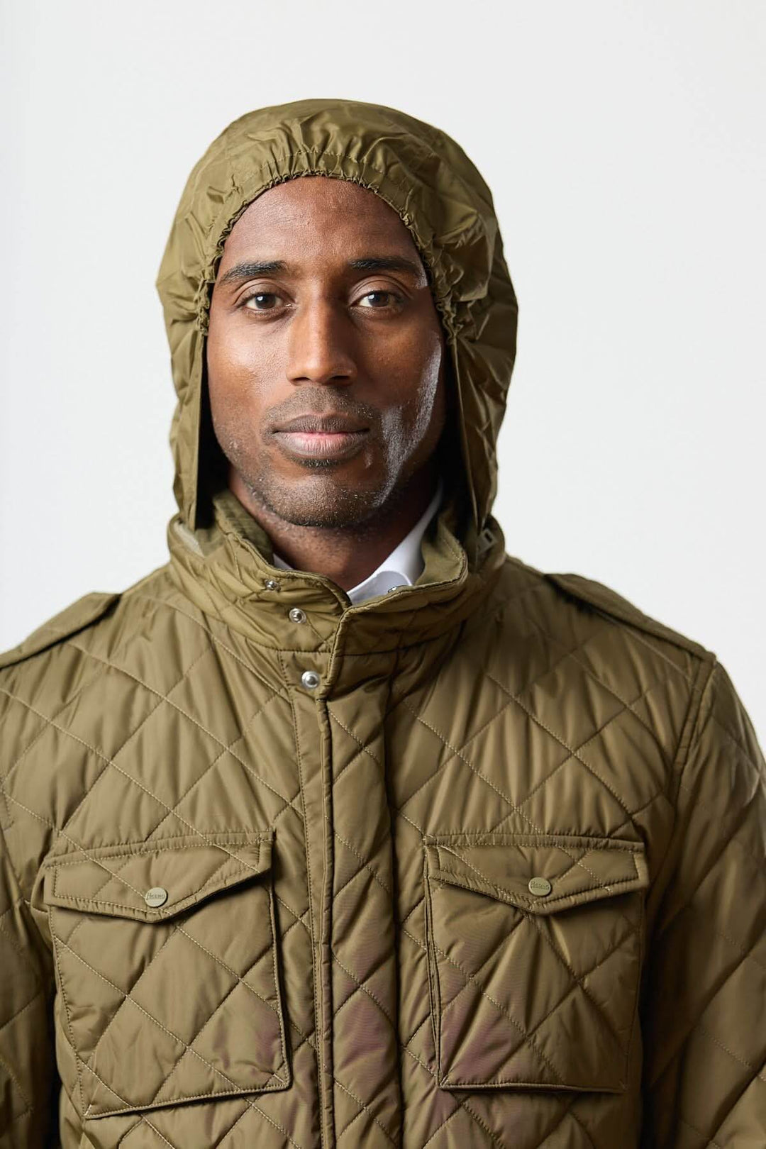 Quilted jacket with stowable hood