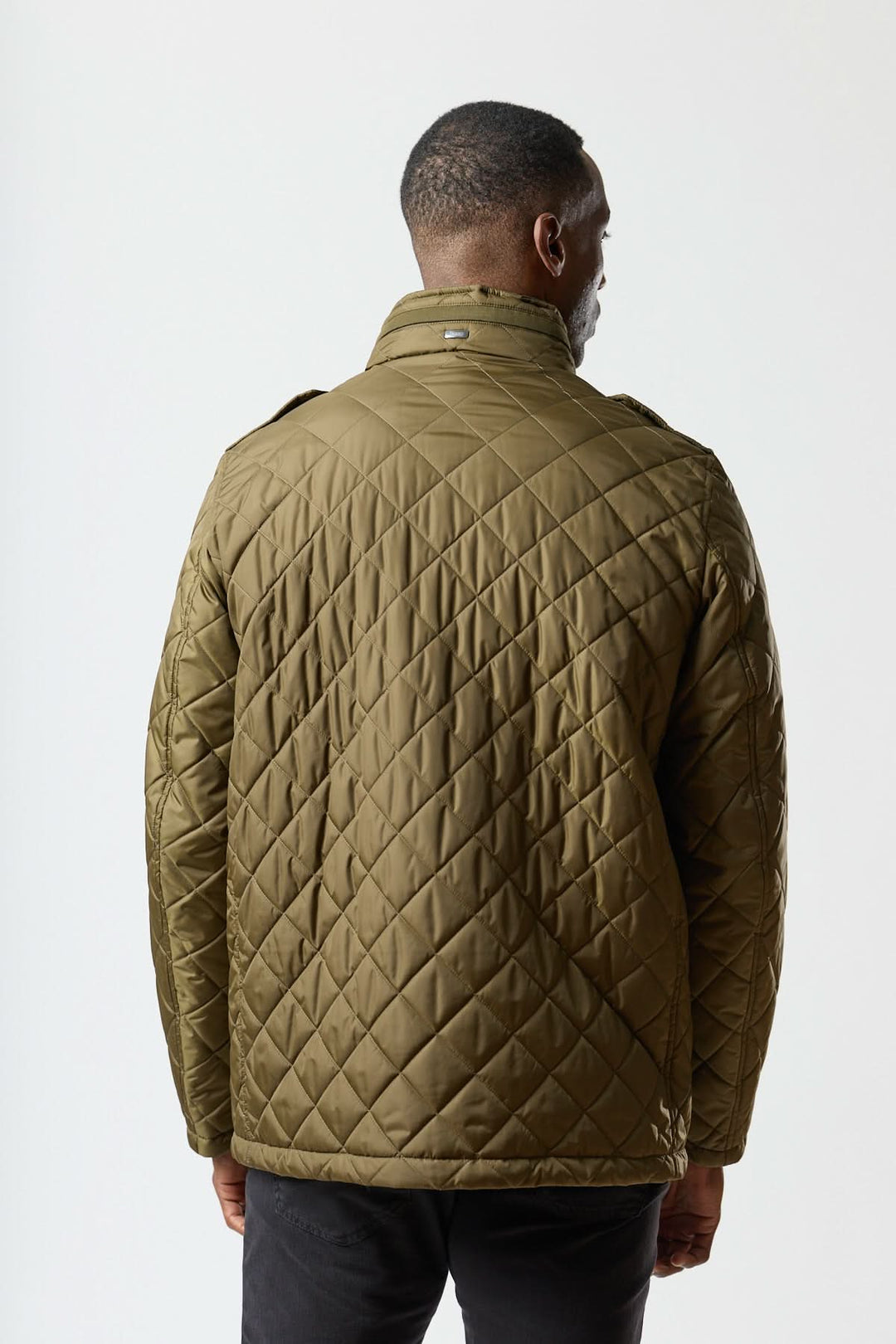Quilted jacket with stowable hood