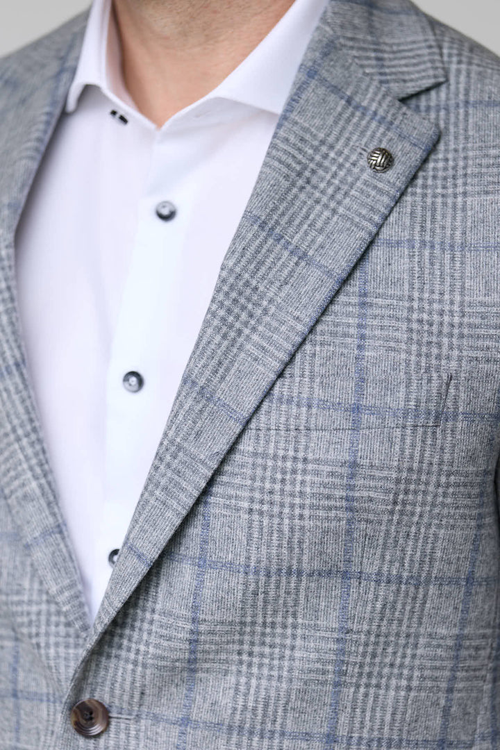 Veston à carreaux moderne en tissu texturé, élégant et ajusté, idéal pour une tenue sophistiquée avec un pantalon habillé.
