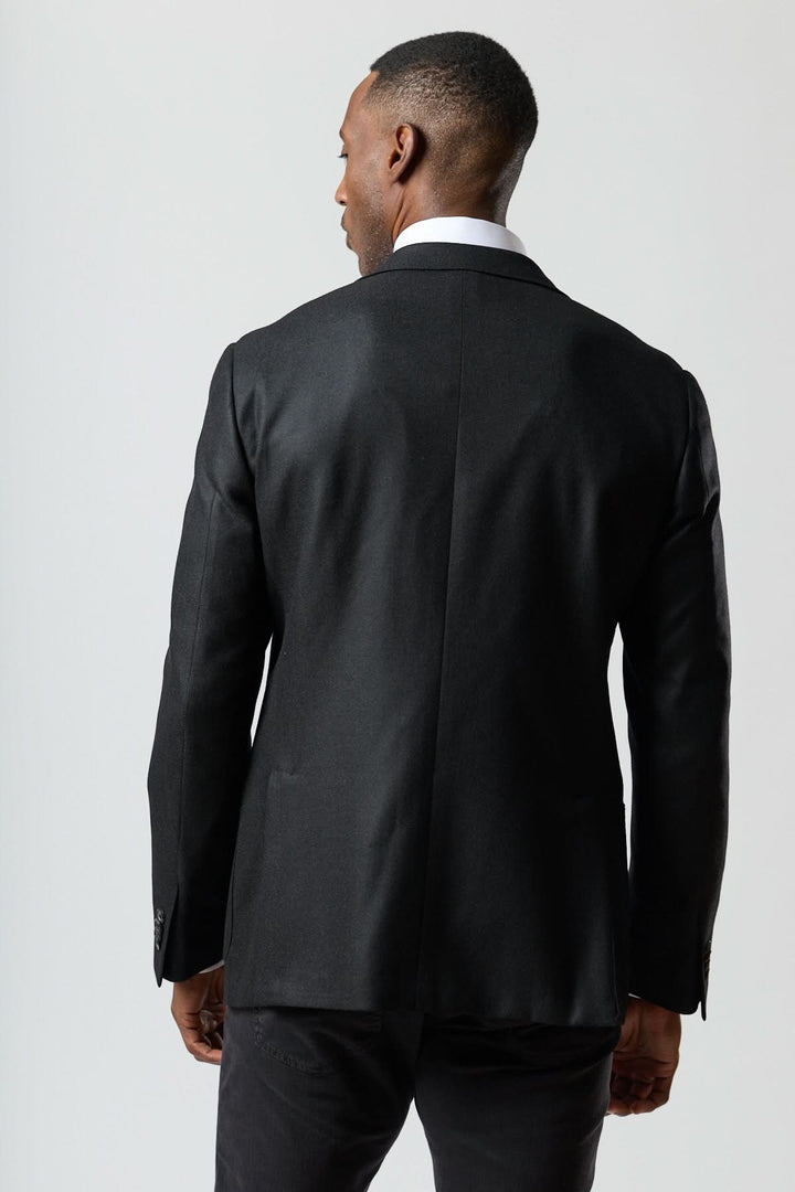 Veston en laine et cachemire noir vu de dos, sophistication italienne, Corneliani. Texture satinée, douceur exceptionnelle.