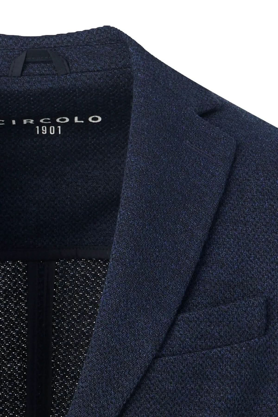 Veston texturé extensible en jersey bleu marine de Circolo 1901, élégant et confortable, détails du col et texture visibles.