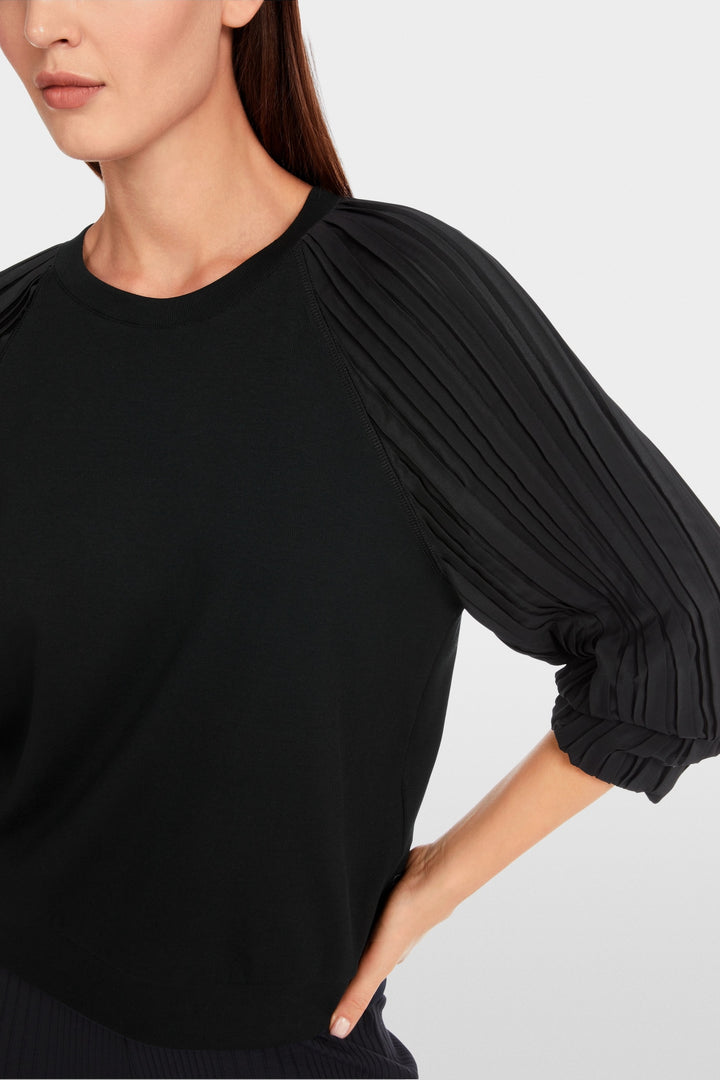 Plain blouse with pleated sleeves