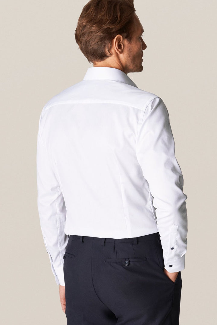 White shirt with navy buttons