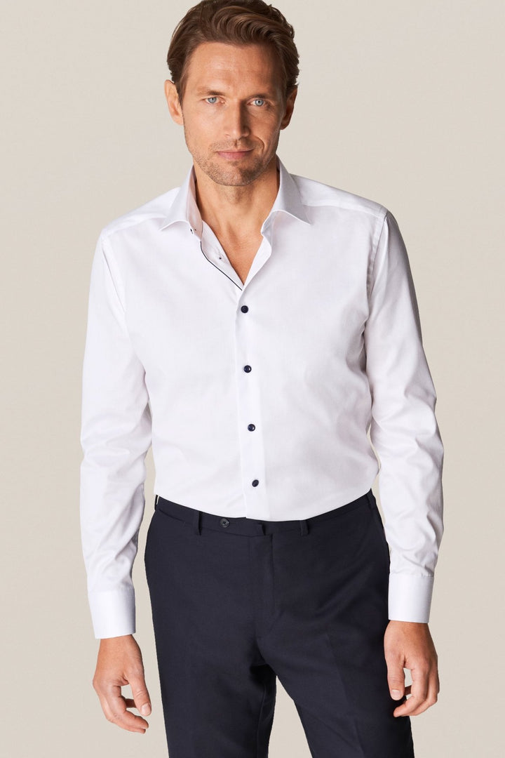 White shirt with navy buttons