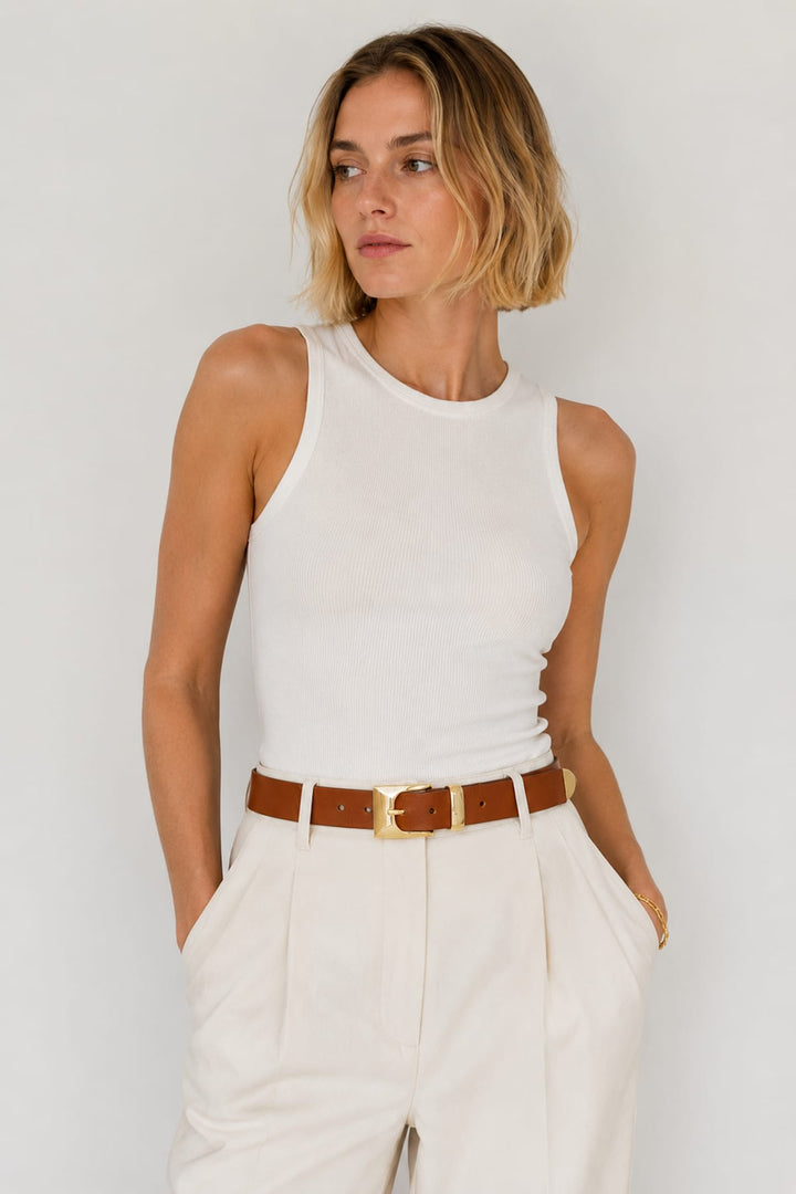 Front view of the black Brave Leather Tomio belt with gold trim and engraved buckle for women - Valérie Simon