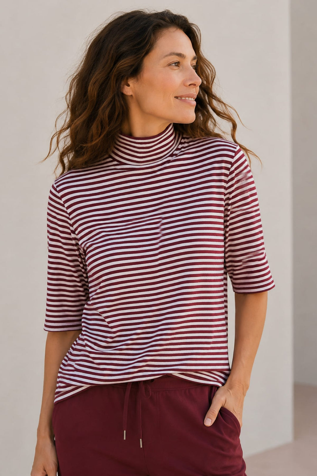 Front view of a striped turtleneck sweater for women by Kennys
