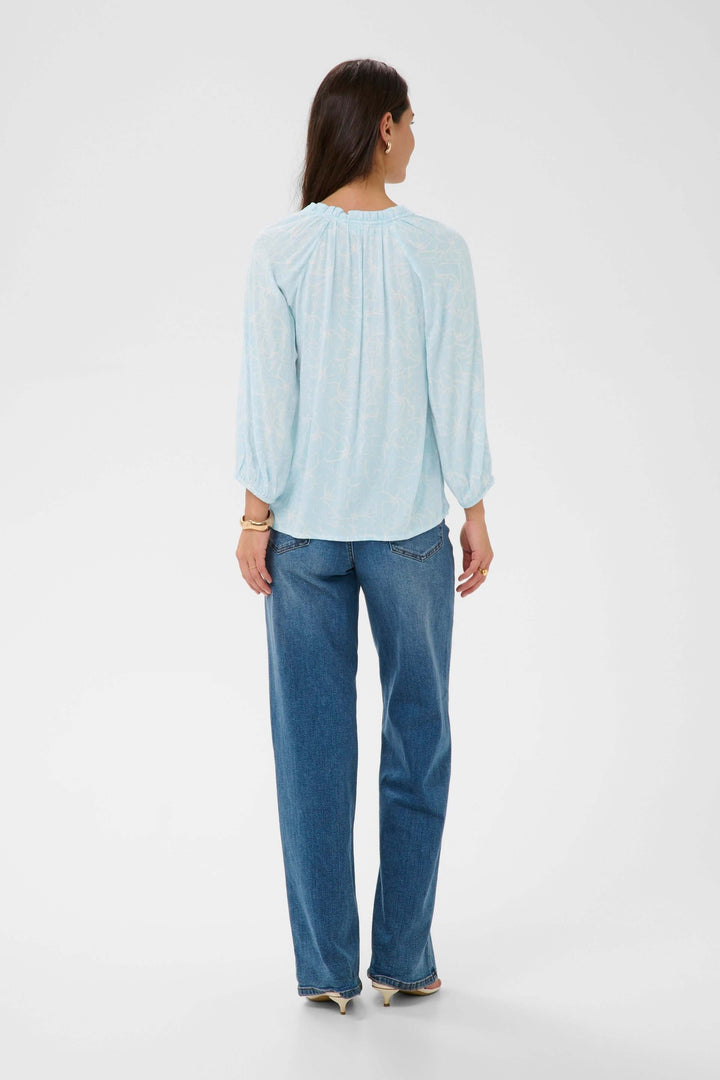 Blouse fluide à imprimé floral discret