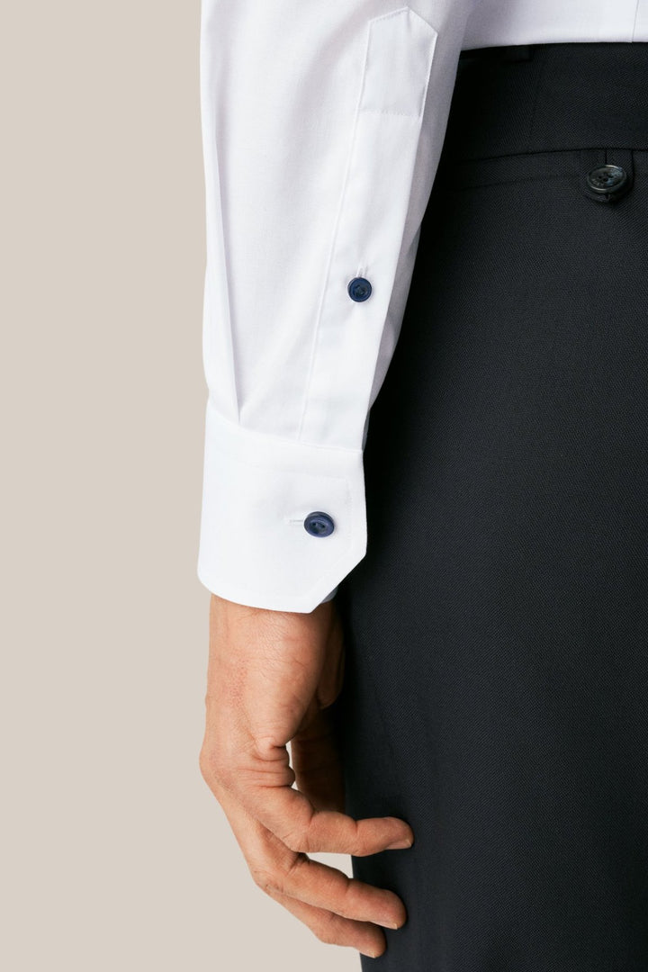 White shirt with navy buttons