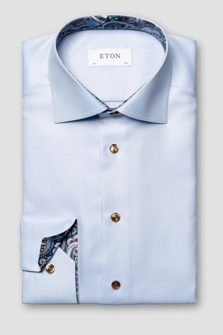 Blue textured shirt with contrasting buttons