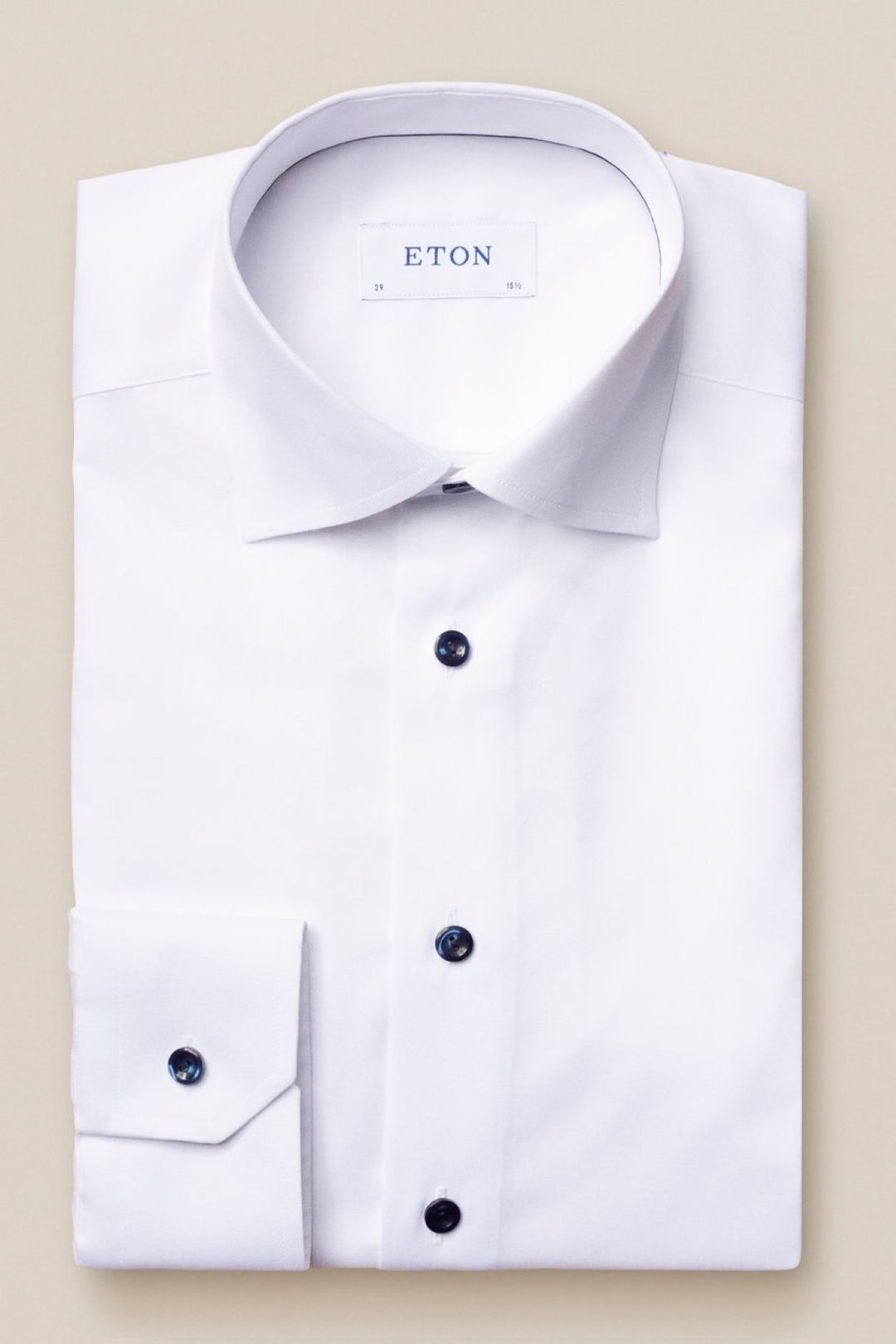 White shirt with navy buttons