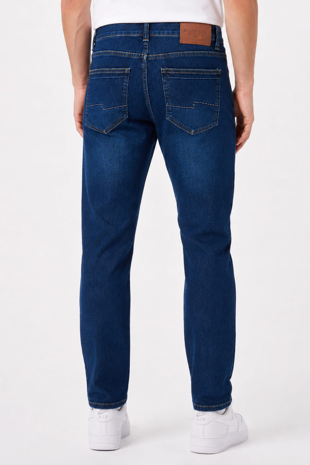 Side view of men's black stretch jeans with exposed seams - Valérie Simon