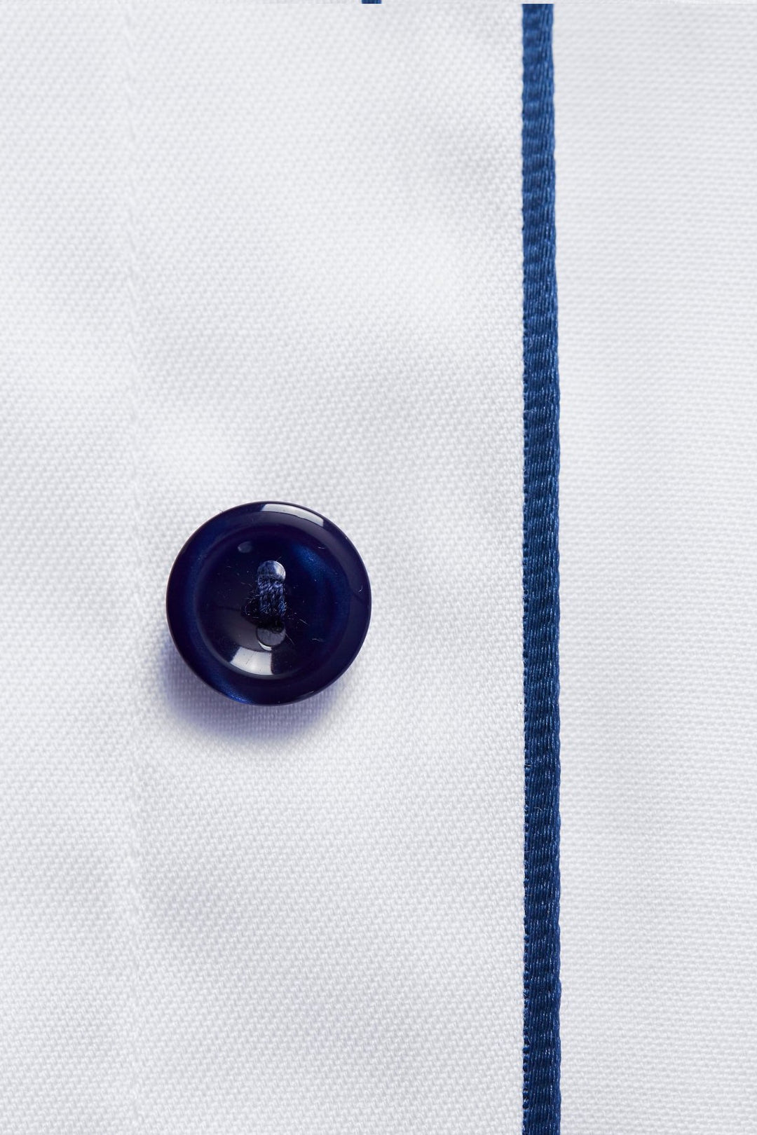 White shirt with navy buttons