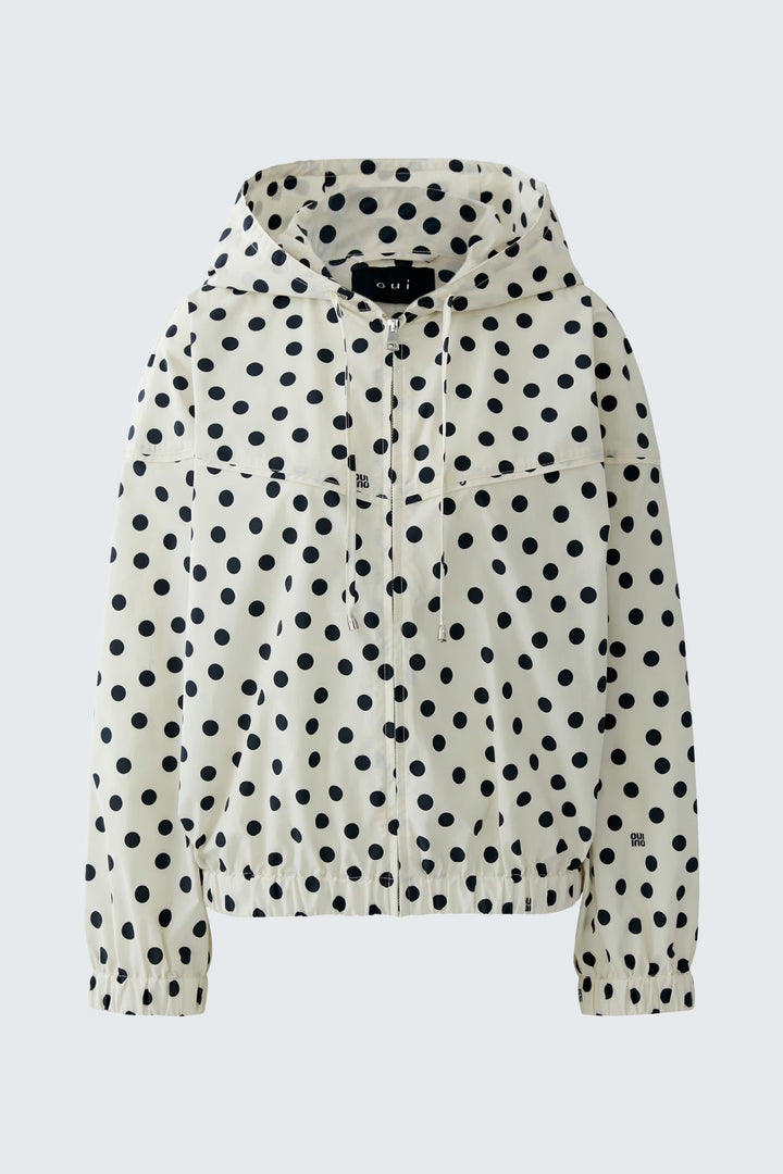 Vue de face manteau à pois noir et blanc pour femme avec capuche attachée - Valérie Simon