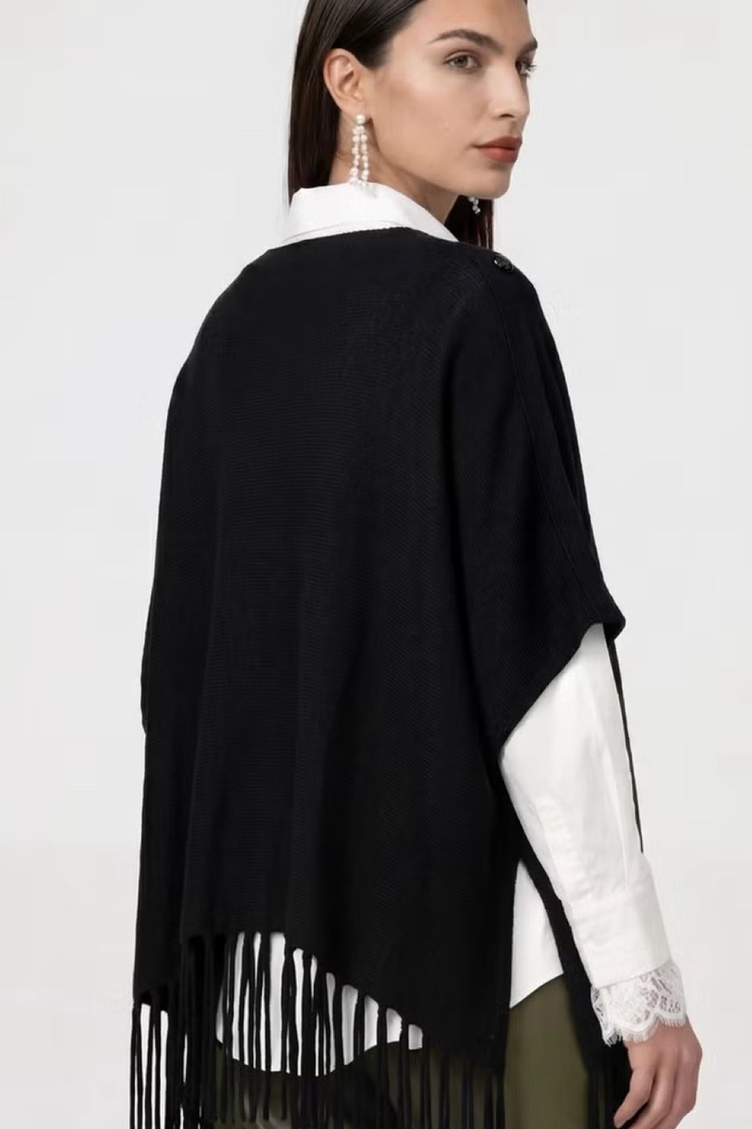 Cape en maille à franges