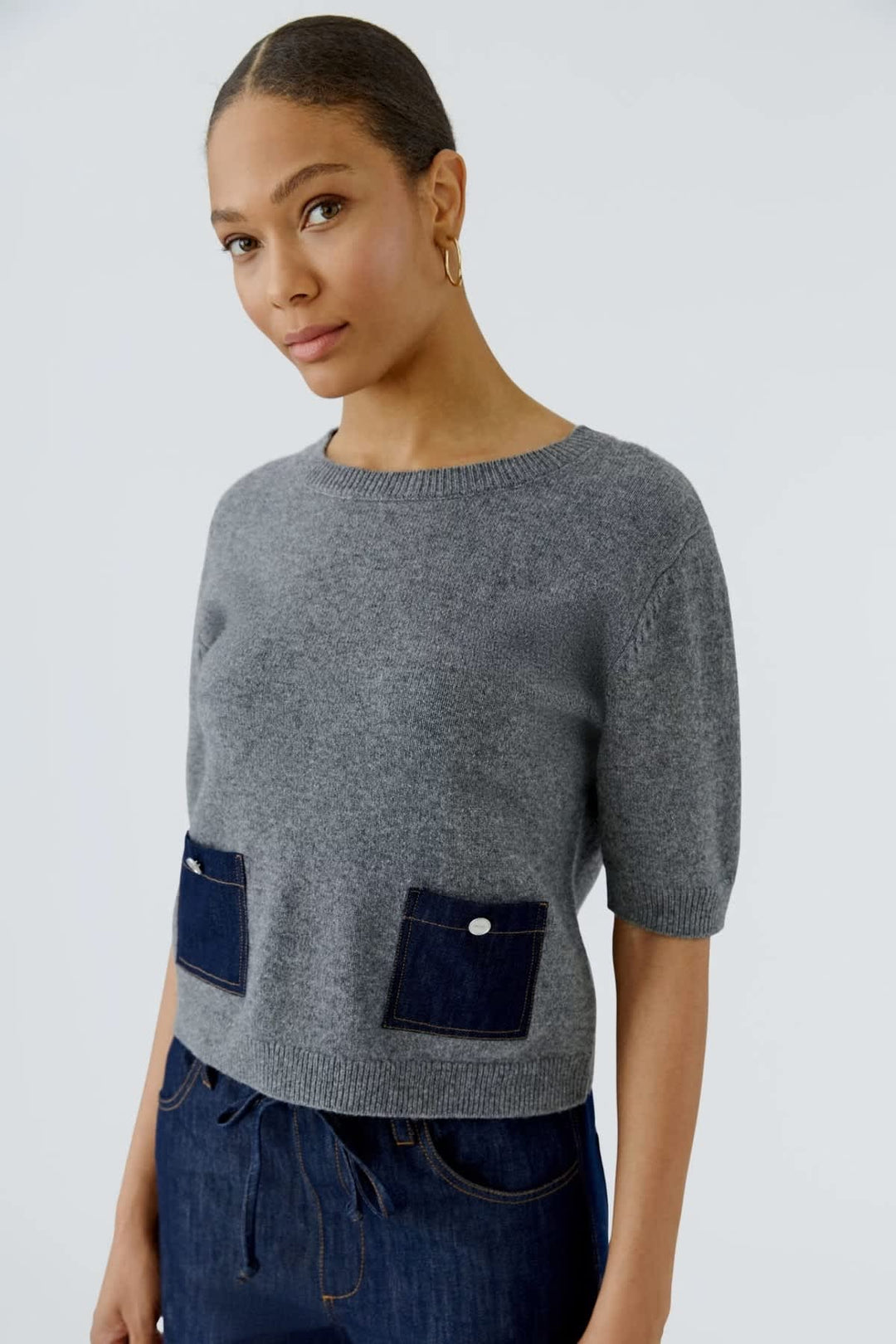 Pull en denim à manches mi-longues avec poches vue de face pour femme Oui