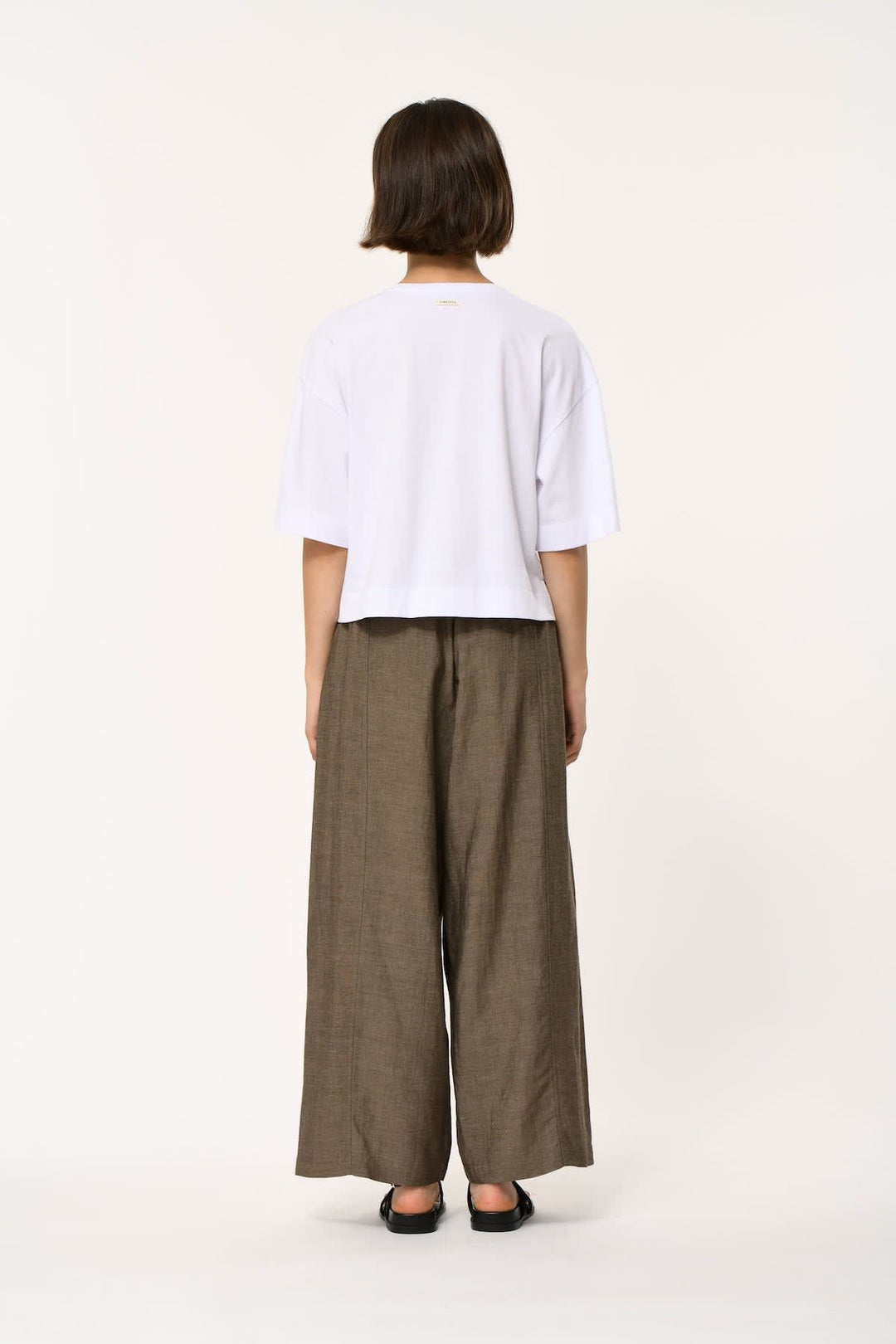 Front view of a loose-fitting white short-sleeved T-shirt Humility for women - Valérie Simon