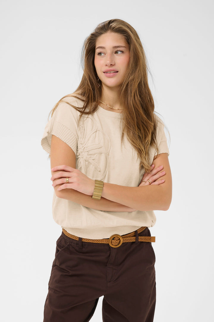 Side view of a cream-colored knitted sweater with appliqué flowers for women - Valérie Simon