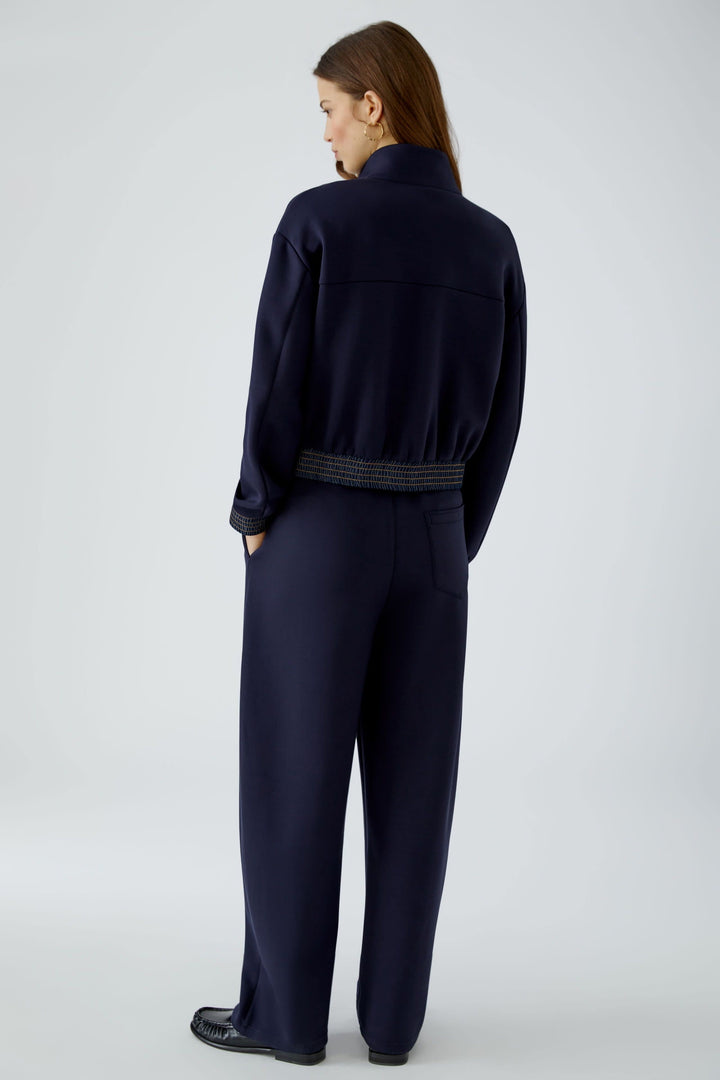 Veste courte zippée bleue à détails en denim vue de face pour femme Oui