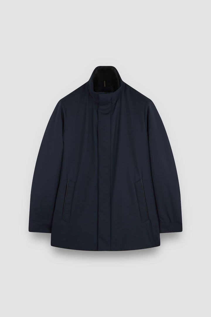 Manteau à col montant en tissu matelassé, doublé fausse fourrure, style urbain intemporel.
