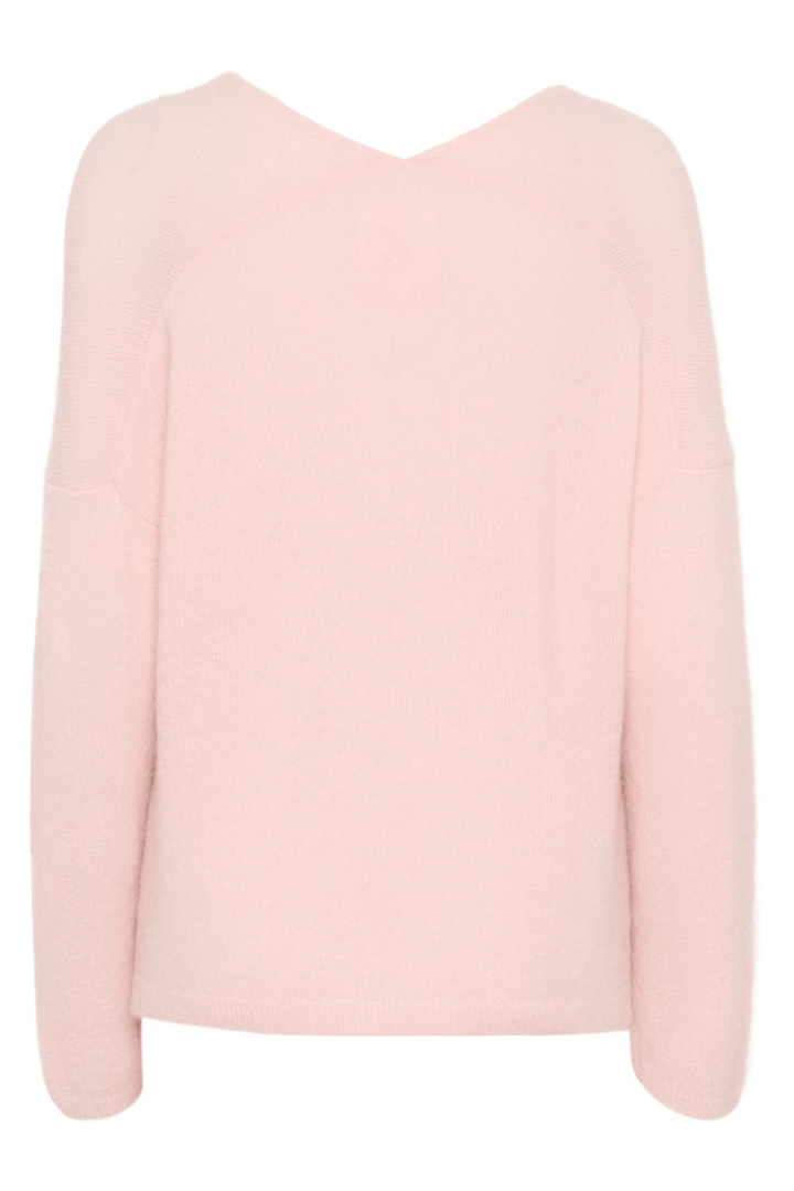 Tricot Titina en maille douce rose avec col en V profond et coupe droite et décontractée pour un style minimaliste.