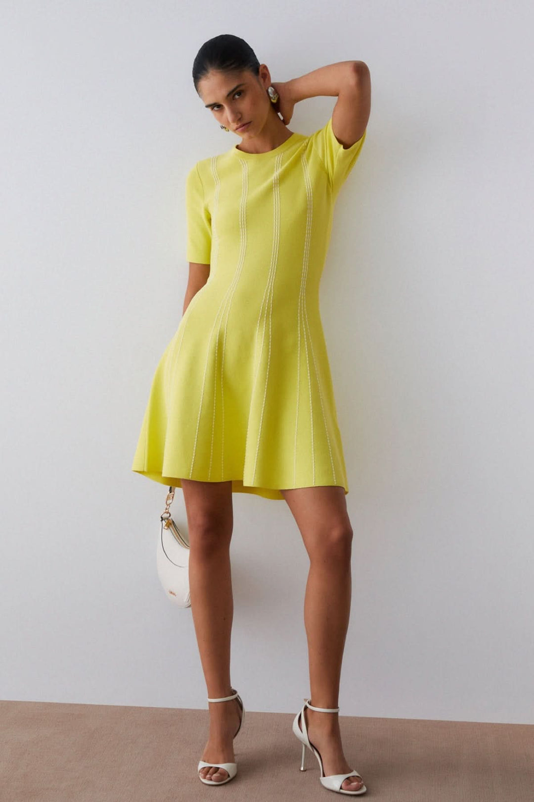 Short knit dress with a striped pattern